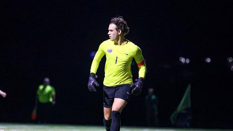 Sasha Mohoruk playing goalie in the middle of a soccer game